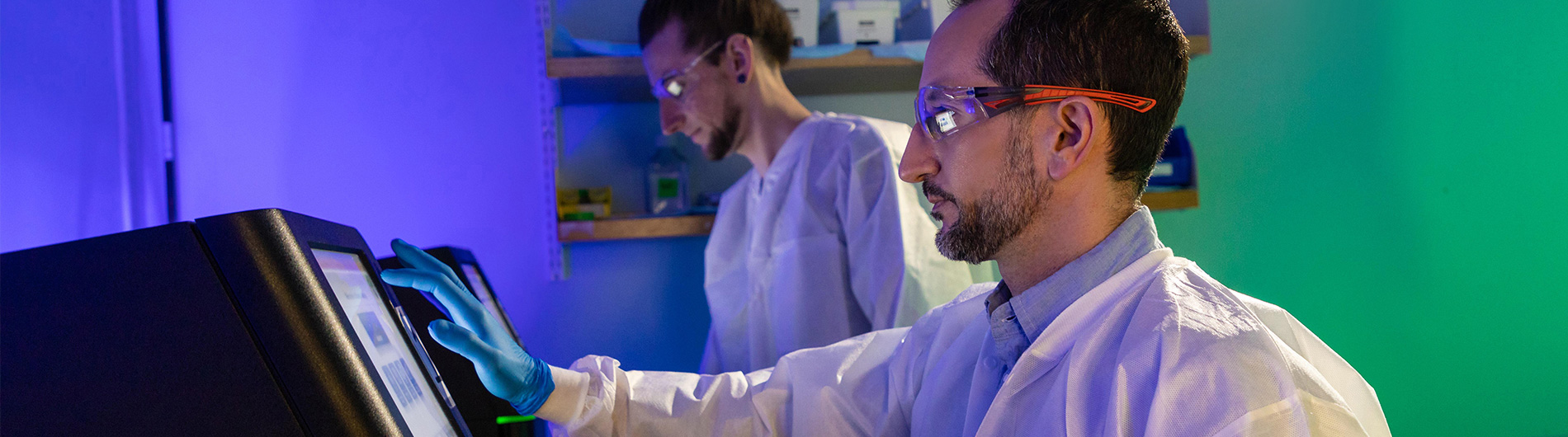 2 Male Researchers Looking at Computers